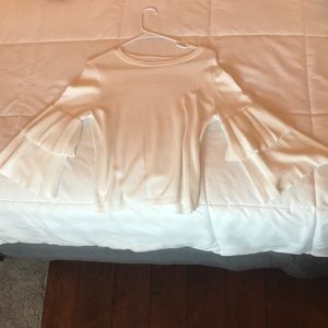 A long sleeve shirt with loose sleeves